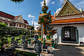 Bangkok Wat Arun - giant demons guarding the gate to the ubosot. Note the chinese dragons at his feet. 